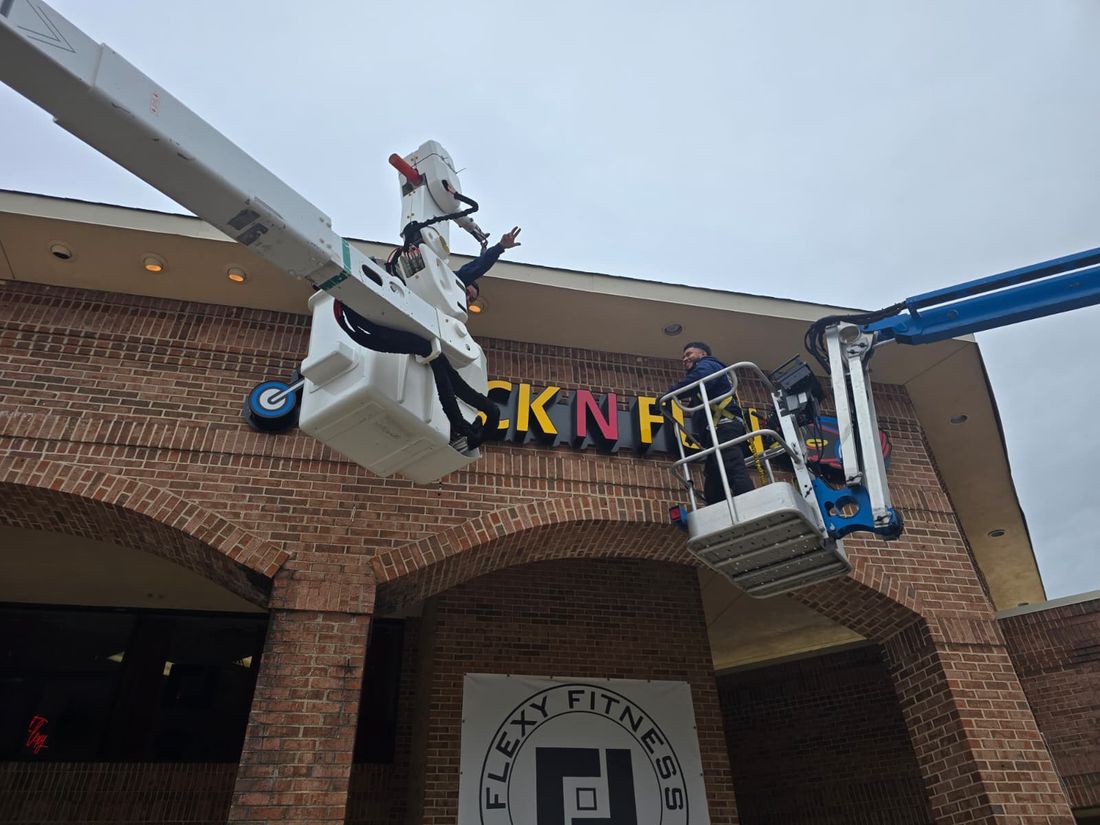 Tech Chefs bucket crew working a storefront facade