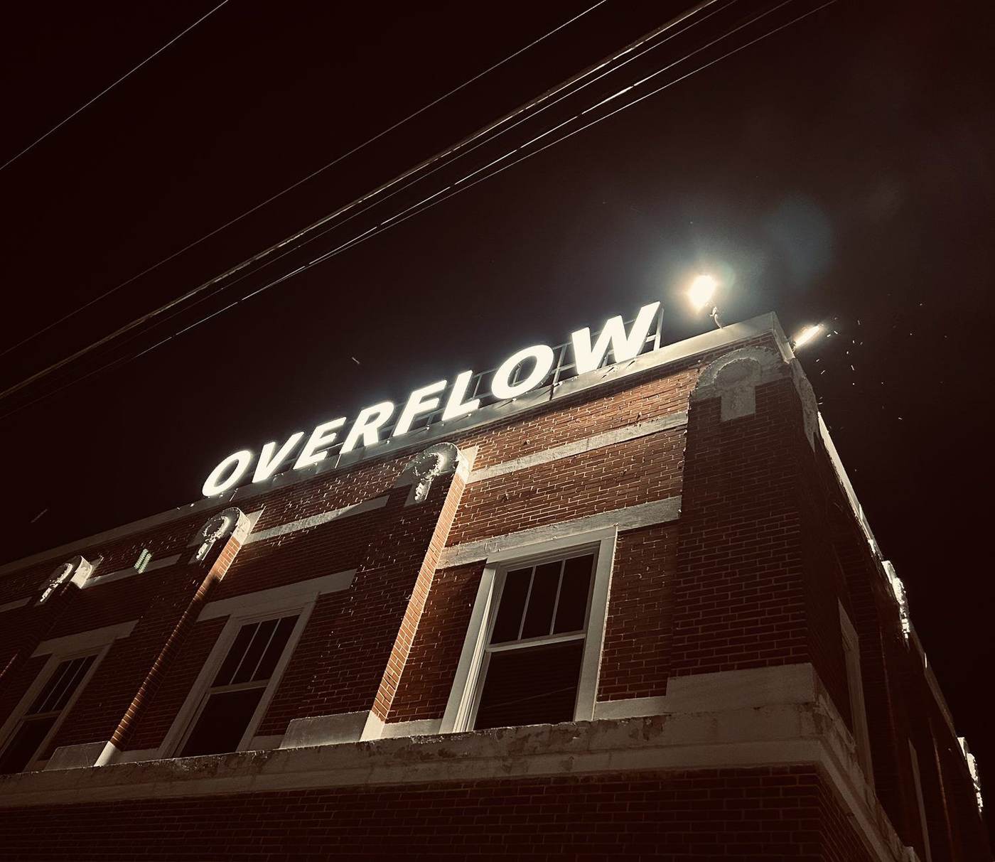 Overflow Church building-top sign at night, installed by Tech Chefs