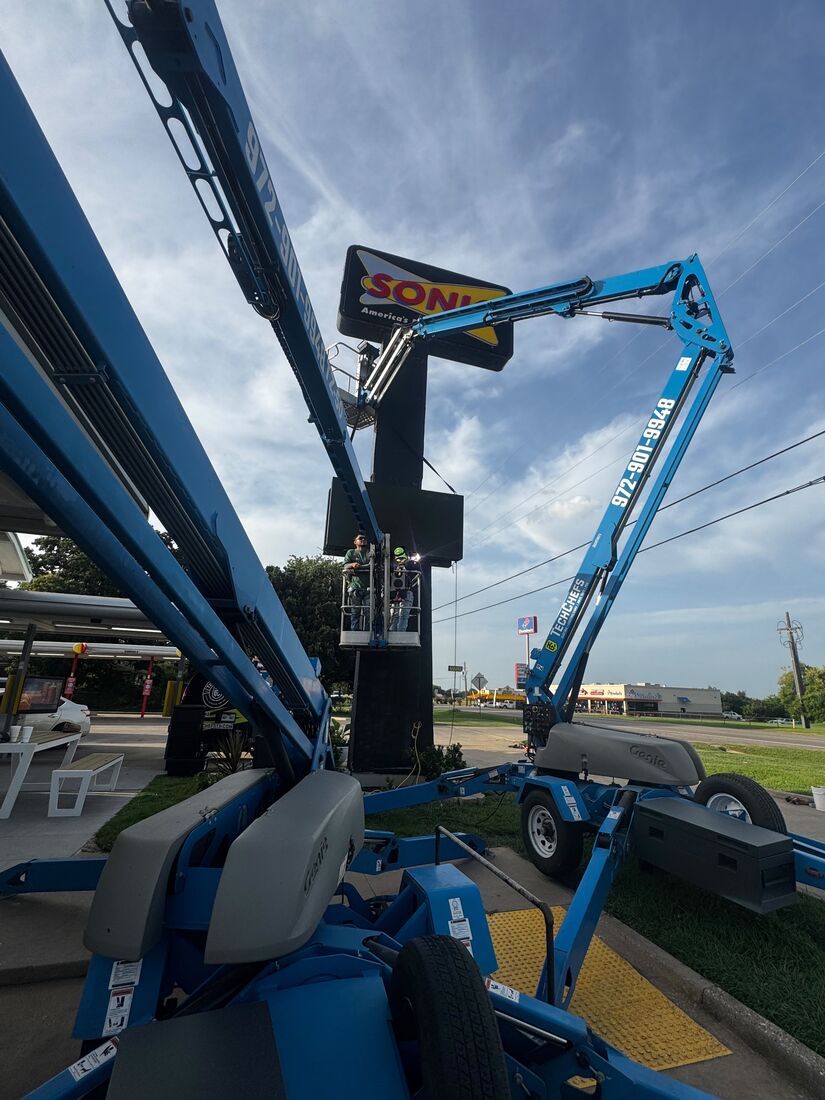 Welding repairs at the top of the sign